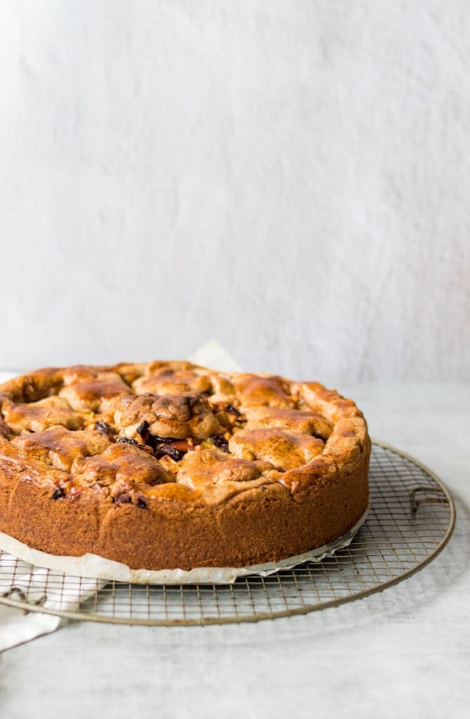 Delicious homemade apple pie cooling on a wire rack for a fresh, rustic feel.